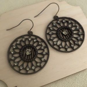 Metal earrings with crystals.